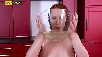 This hot redhead strips, fingers her pussy and then takes a piss all over her shorts, soaking them and then tasting her pee from them. Turned on, she then fucks herself in the ass with a glass dildo.